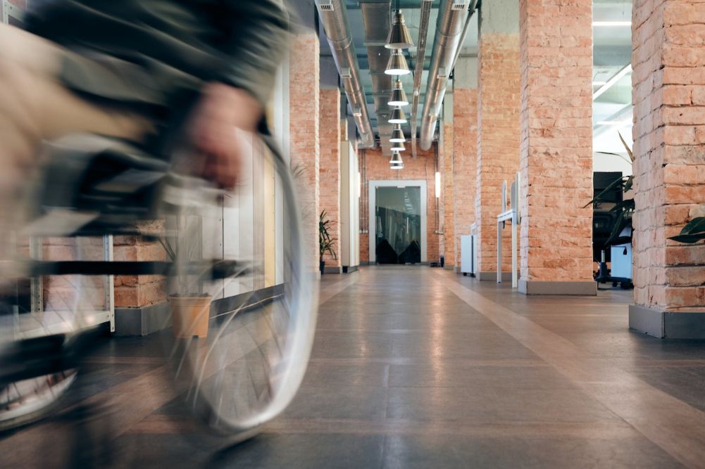 Wheelchair rolling through hallway